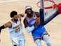  Oklahoma City Thunder Luguentz Dort eyes the basket as he drives the lane versus Denver Nuggets on October 16, 2024